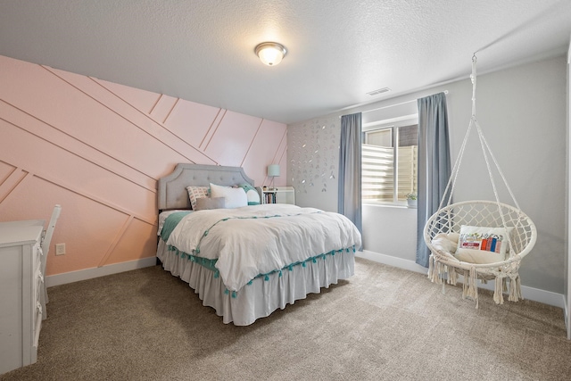 carpeted bedroom featuring a textured ceiling