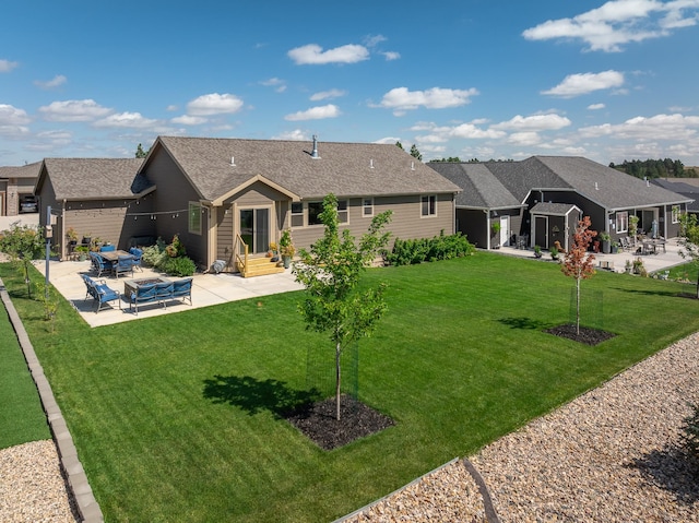 back of house with a lawn and a patio