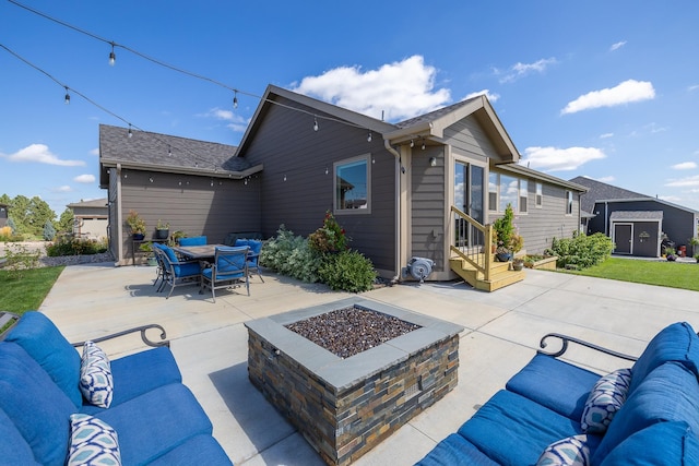 view of patio featuring an outdoor living space with a fire pit