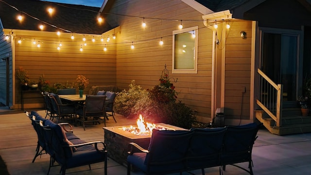 view of patio / terrace featuring an outdoor fire pit