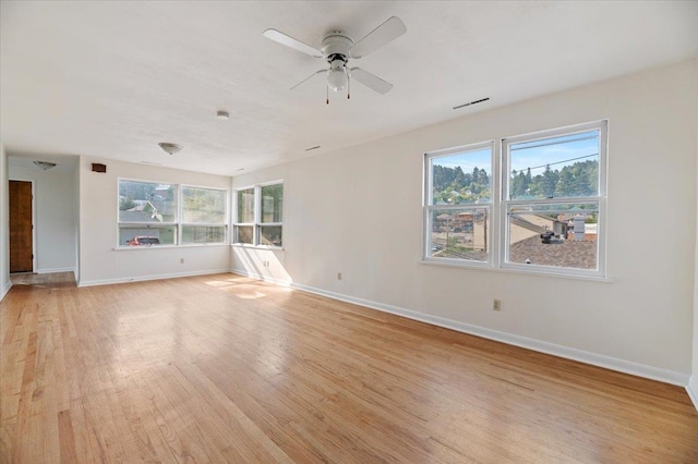 unfurnished room featuring ceiling fan and light hardwood / wood-style flooring