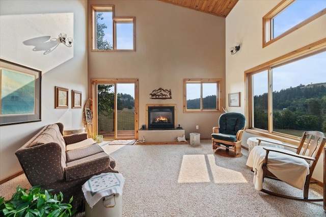 living room featuring wooden ceiling, high vaulted ceiling, and carpet floors