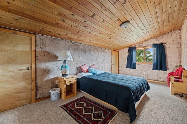 bedroom with lofted ceiling, carpet, and wood ceiling