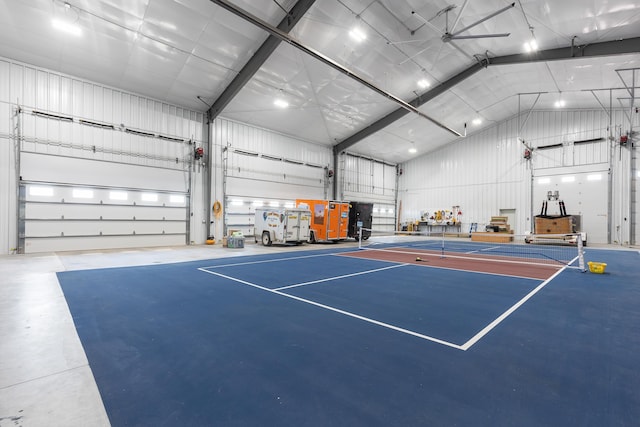 view of tennis court with basketball hoop