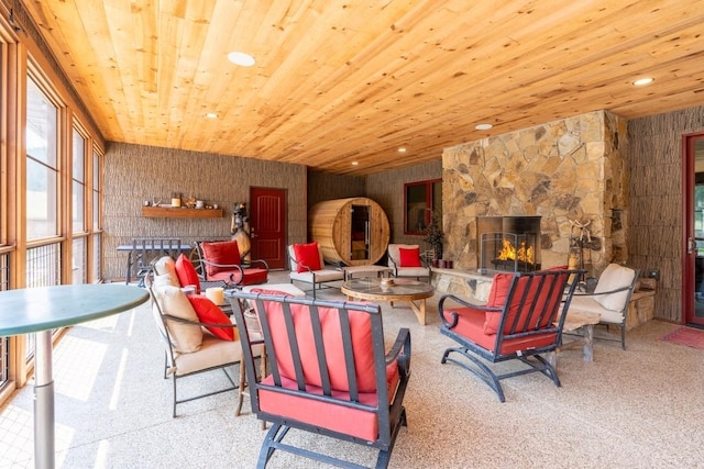 interior space featuring wooden ceiling and a fireplace