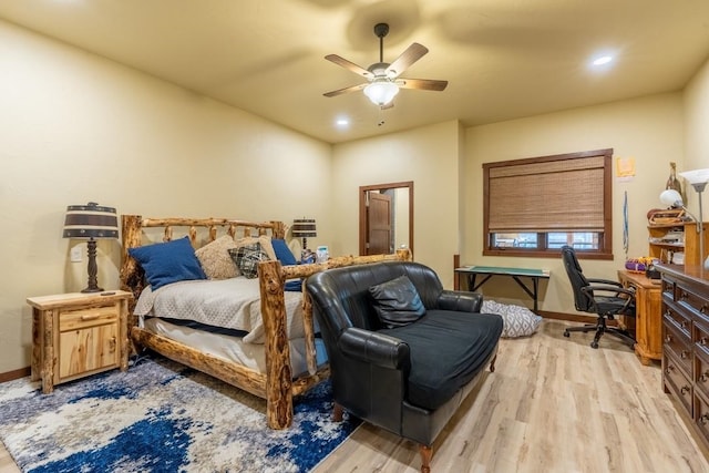 bedroom featuring light wood-type flooring and ceiling fan