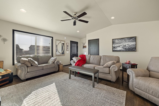 living room with vaulted ceiling, ceiling fan, and dark hardwood / wood-style flooring