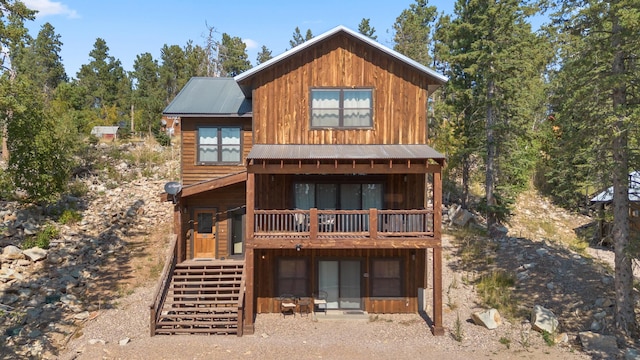 view of front of home featuring a patio and a balcony