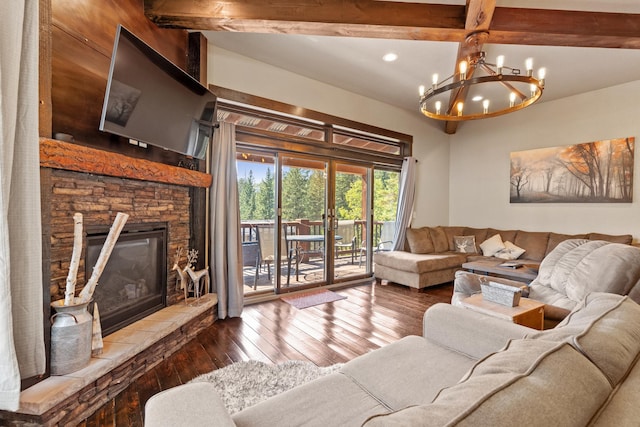 living room with beam ceiling, a chandelier, hardwood / wood-style flooring, and a stone fireplace