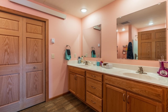 bathroom featuring hardwood / wood-style floors and vanity