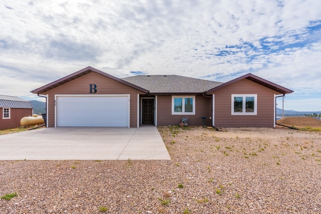 ranch-style home featuring a garage