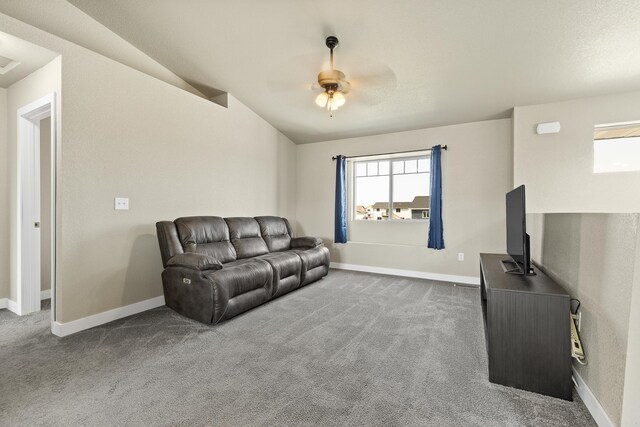 living room with dark carpet and ceiling fan