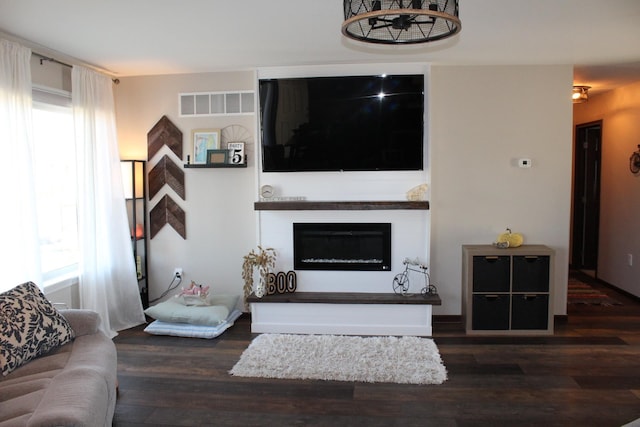 living room with dark wood-type flooring