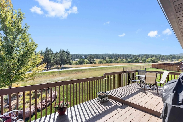 wooden deck with a lawn