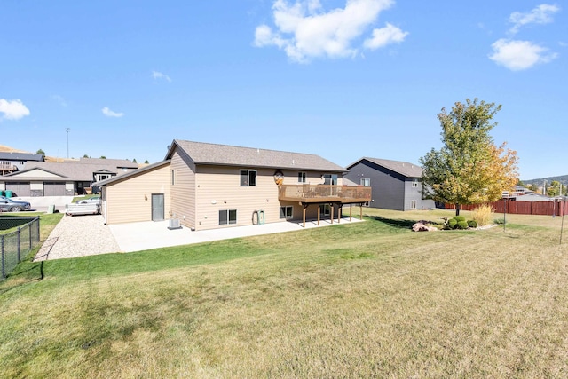 back of house with a yard and a patio area