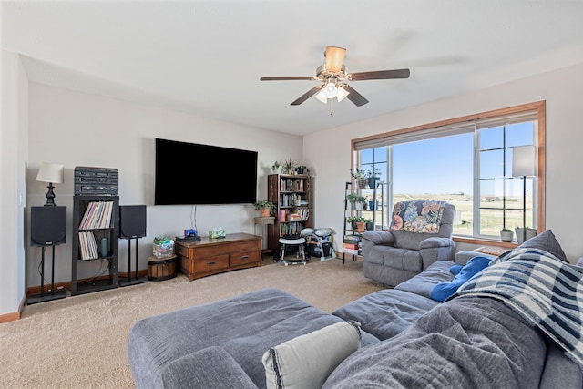 carpeted living room featuring ceiling fan