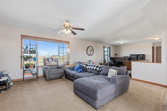 living room featuring carpet and ceiling fan