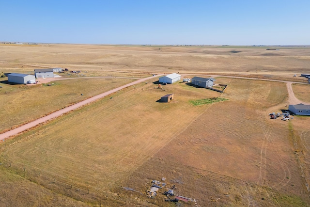 birds eye view of property featuring a rural view