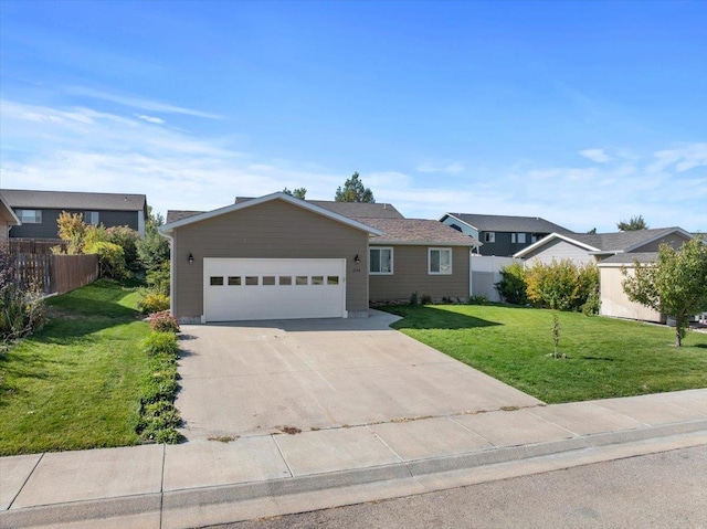 single story home featuring a front lawn and a garage