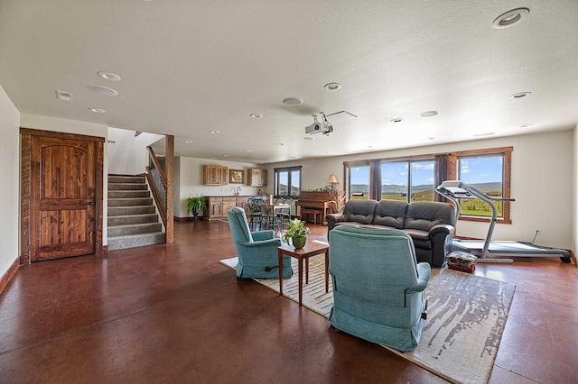 living room with a textured ceiling