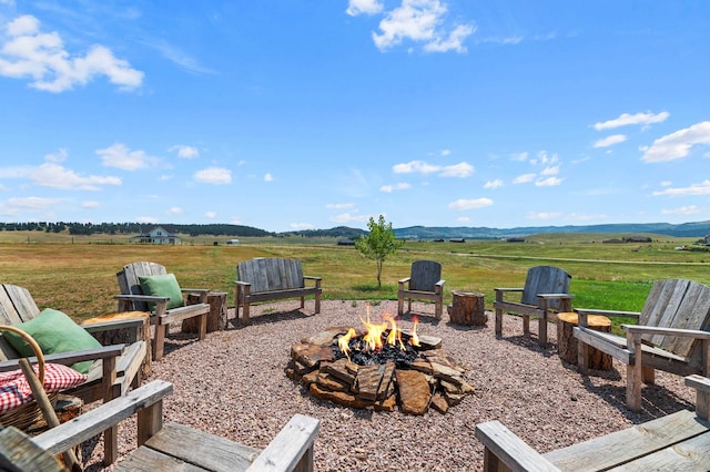 view of patio / terrace featuring a fire pit and a rural view