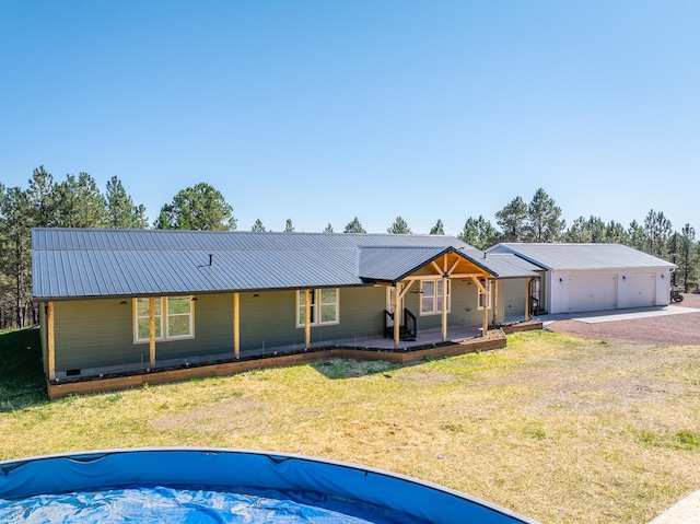 ranch-style home featuring a garage and a front yard