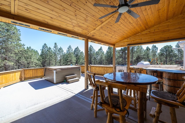 view of patio / terrace featuring grilling area, a hot tub, and ceiling fan