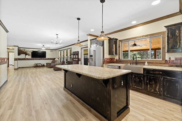 kitchen with high quality fridge, a kitchen island, decorative light fixtures, a breakfast bar, and light wood-type flooring