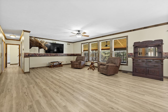 living room with crown molding, ceiling fan, and light hardwood / wood-style floors