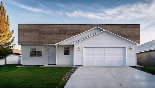 ranch-style house featuring a front yard and a garage