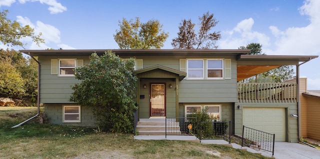 split foyer home with a front lawn