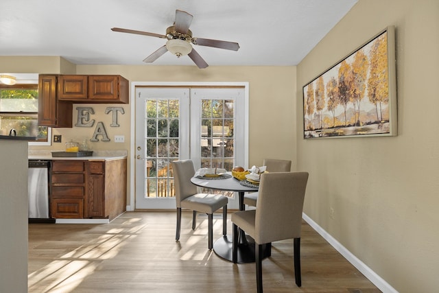 dining area featuring light hardwood / wood-style floors and ceiling fan