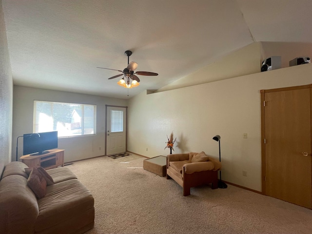 carpeted living room featuring lofted ceiling and ceiling fan