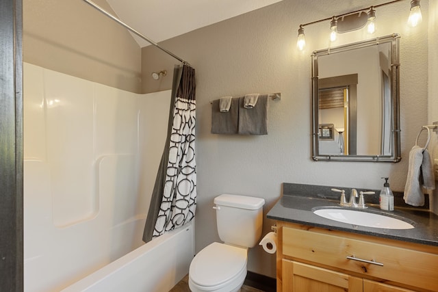 bathroom featuring shower / bath combo, vanity, and toilet