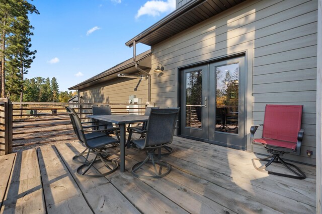 wooden deck with outdoor dining area