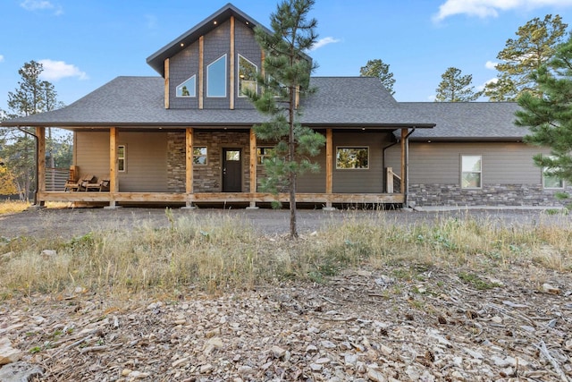 chalet / cabin with roof with shingles