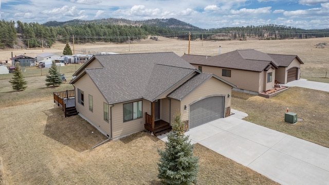 view of front of house with a mountain view and a garage