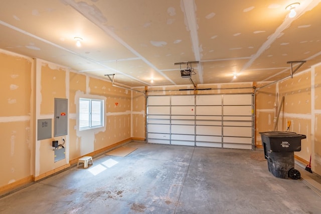 garage featuring a garage door opener and electric panel