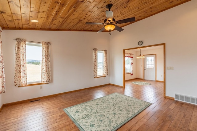 spare room with wooden ceiling, vaulted ceiling, and hardwood / wood-style flooring