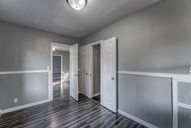 unfurnished bedroom featuring dark wood-type flooring