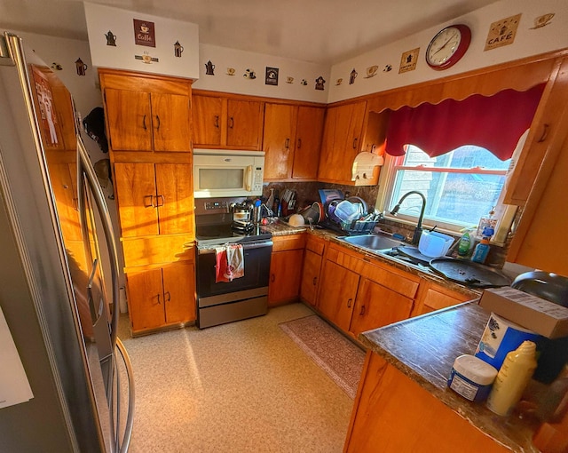 kitchen with appliances with stainless steel finishes and sink