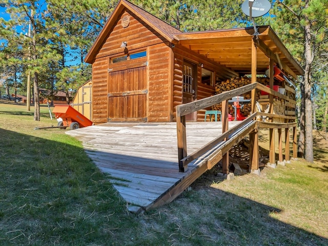 view of outbuilding featuring a yard