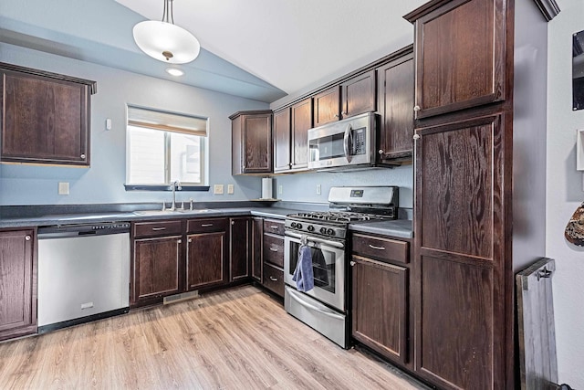 kitchen featuring sink, pendant lighting, light hardwood / wood-style floors, dark brown cabinetry, and stainless steel appliances