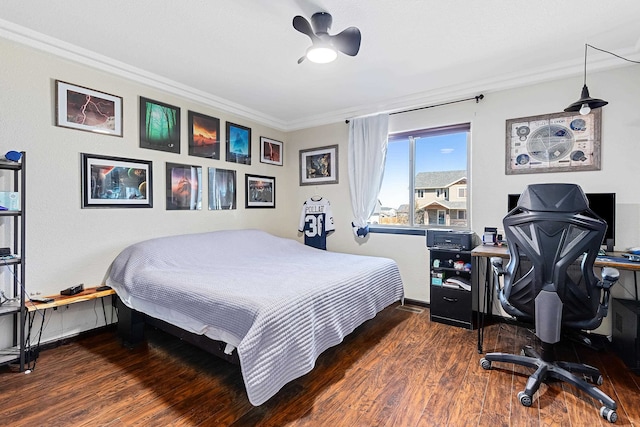 bedroom with crown molding, ceiling fan, and dark hardwood / wood-style flooring