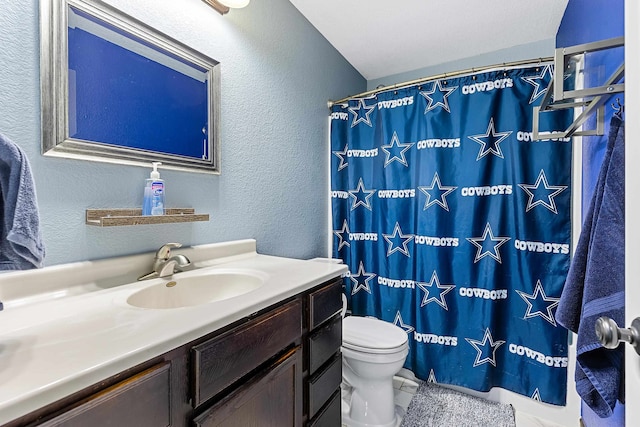 bathroom featuring vanity, toilet, and a shower with shower curtain