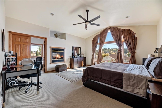 bedroom with carpet, vaulted ceiling, and ceiling fan