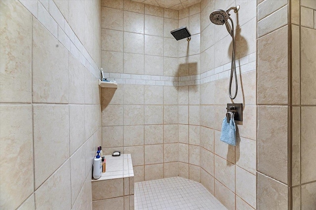 bathroom with tiled shower