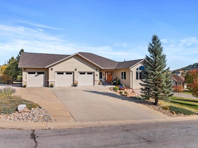 ranch-style home featuring a garage