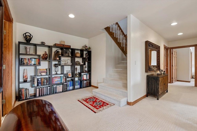 stairway featuring carpet flooring