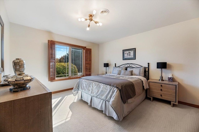 bedroom featuring light carpet